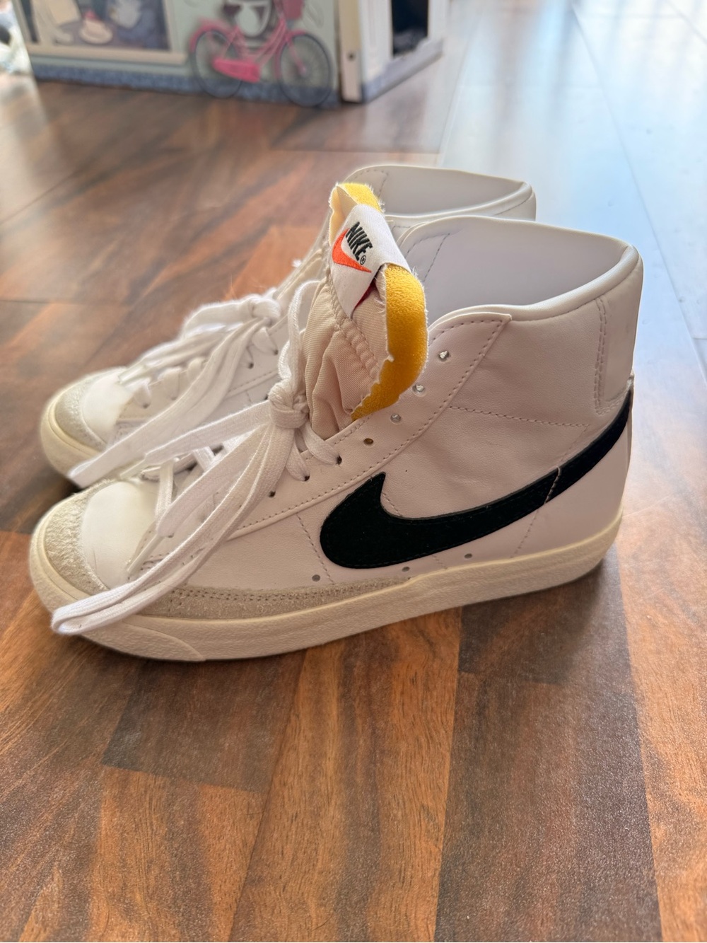 Nike Kids White High-Top Sneakers with Black Swoosh and Yellow Tongue